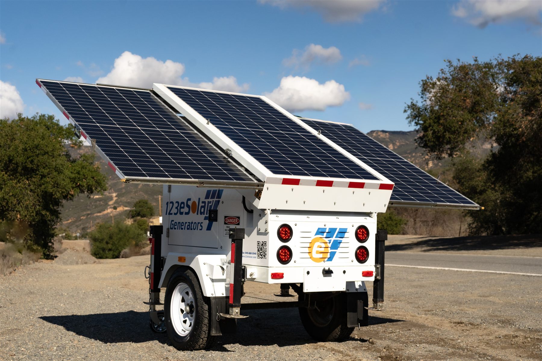123-SG-1A10 — Three panels tilted to the sun on a single-axle trailer: 48 V DC power with no engine to fuel.