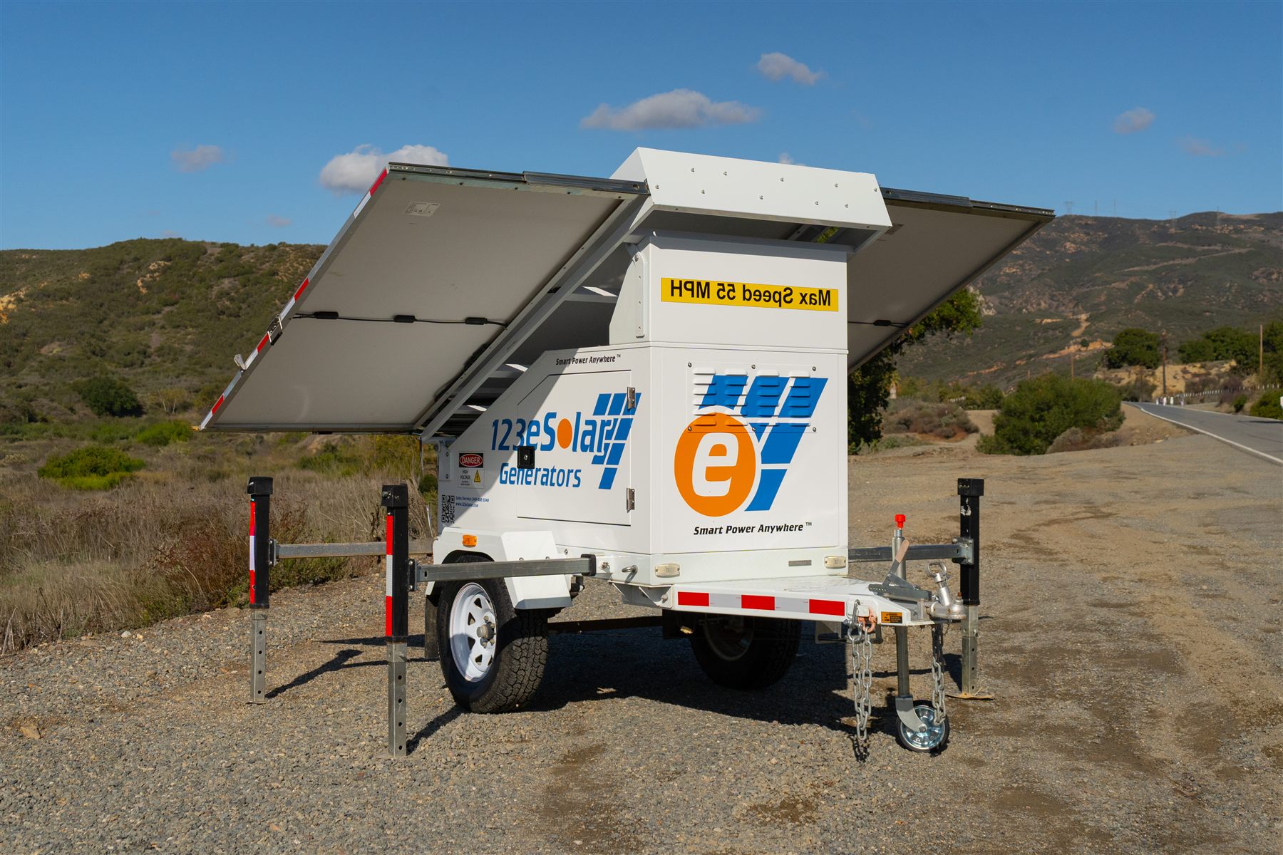 123-SG-1A10 — The panels hinge out from the roof, on a trailer small enough to set down at the edge of a road.