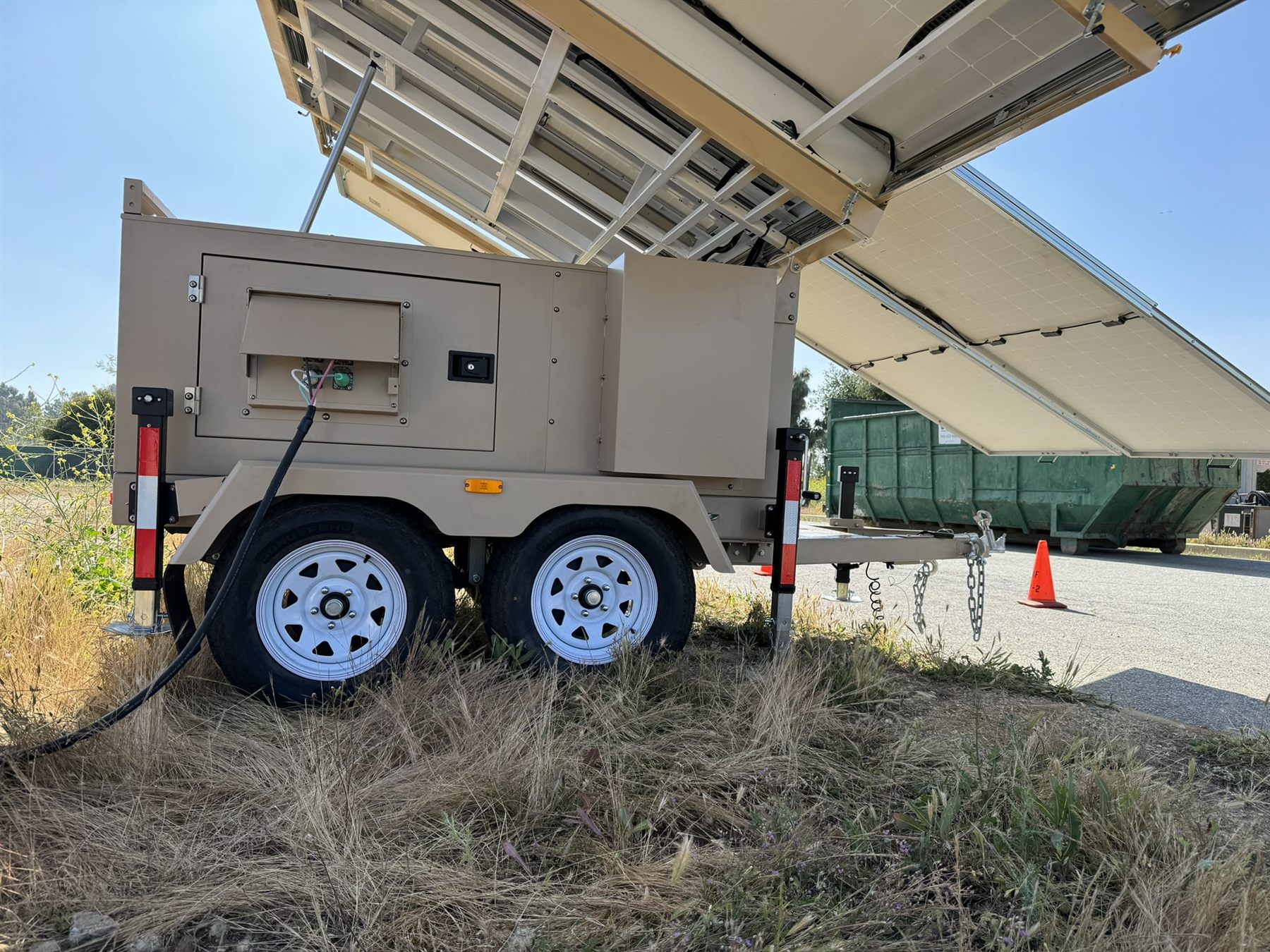 123-STG-42S51 — Service access and power connections on the generator side, with the array raised overhead.