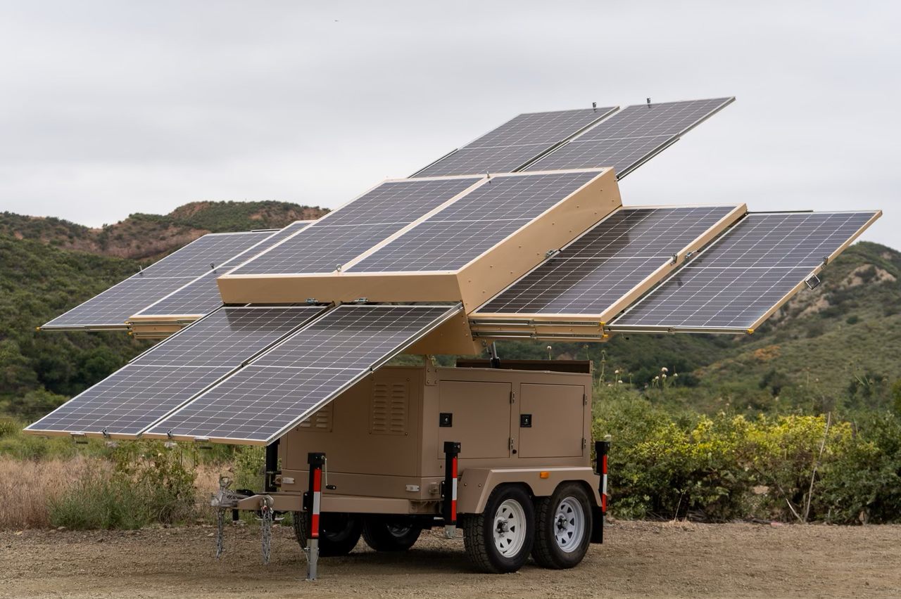 123-STG-42S51 — Ten panels open past the trailer to harvest 19.8 kWh on an average day.