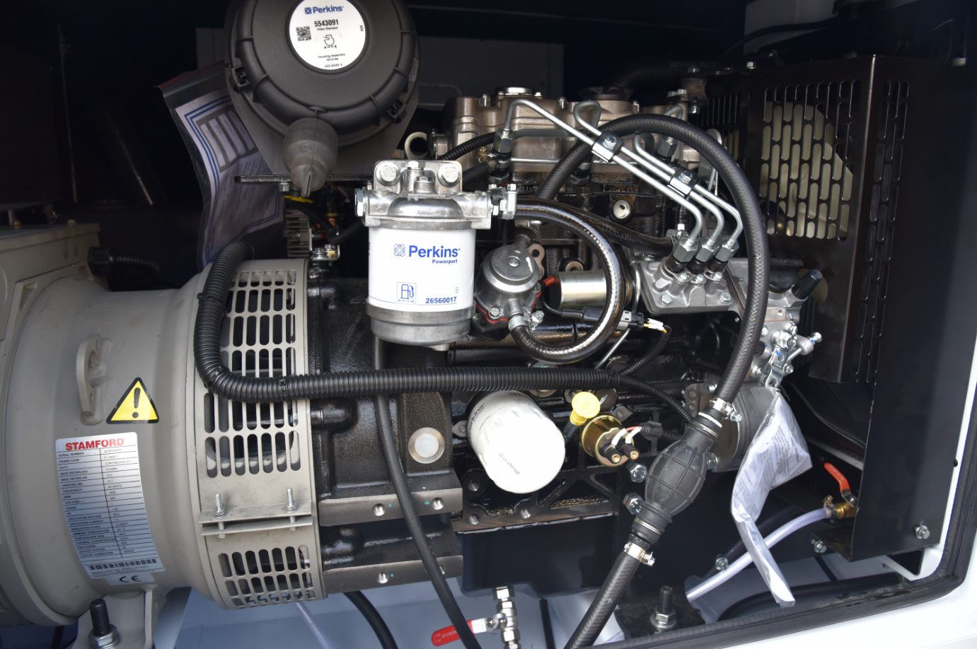 123-STG-71S62 — The EPA Tier 4 Final diesel generator, reached through its service door.