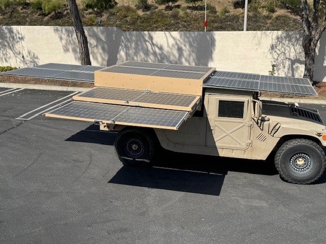 The array opened out flat on both sides of the HMMWV and over the cab