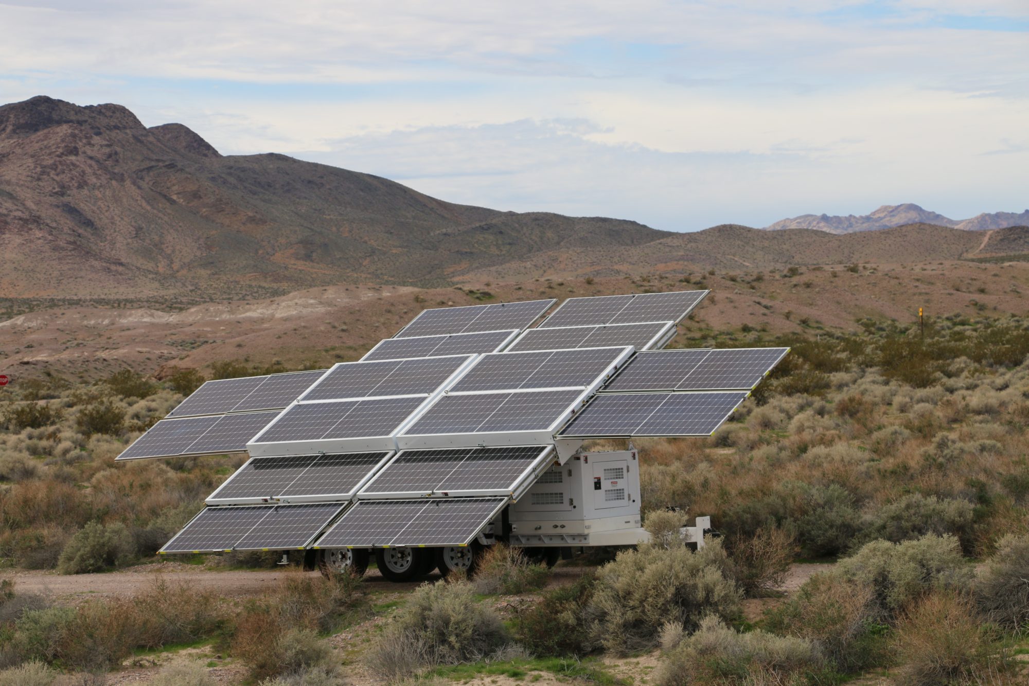 The 123-STG-72D62 with its sixteen-panel array open in the desert