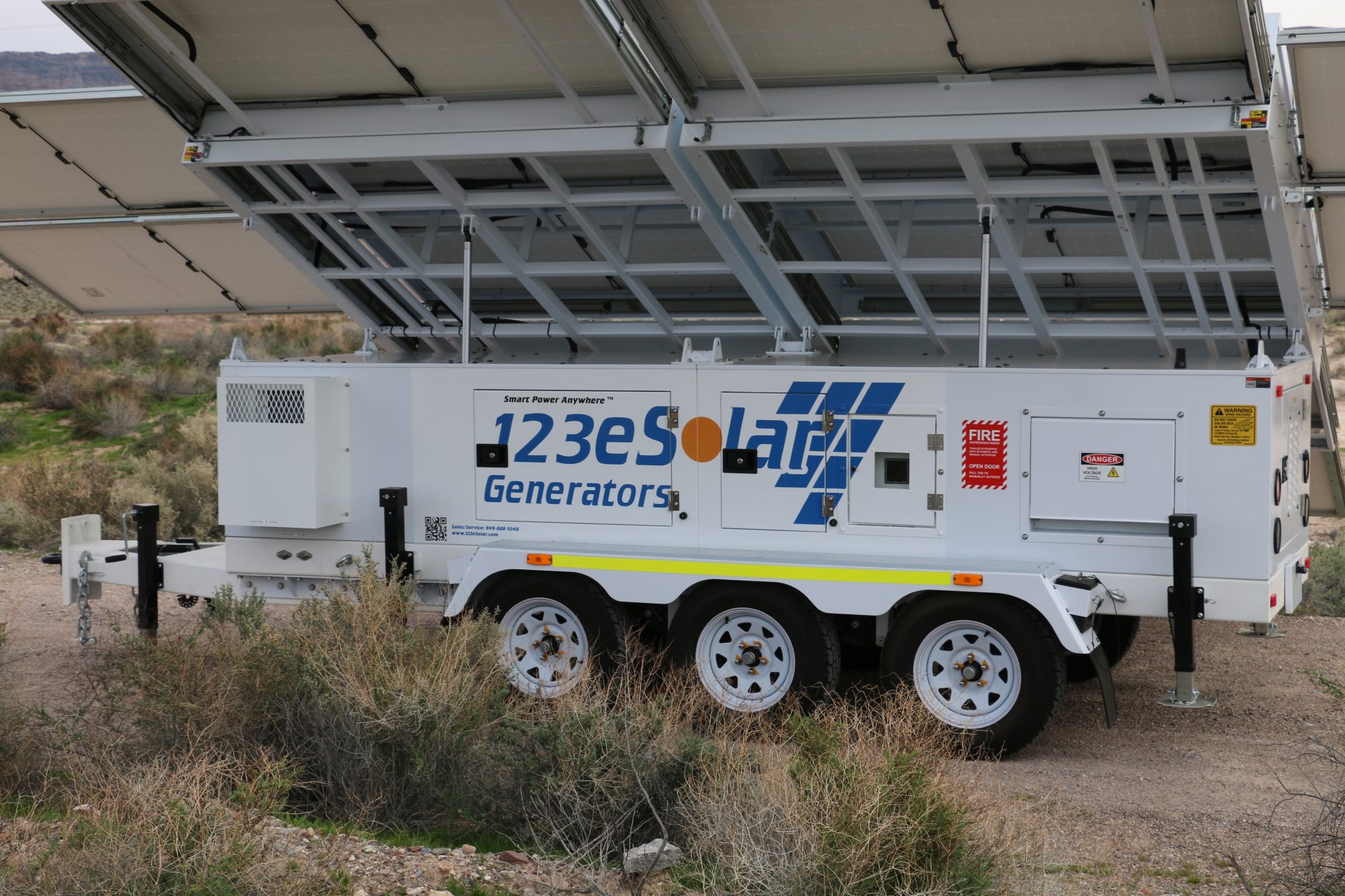 The 123-STG-72D62 on its triple-axle trailer, the array raised overhead